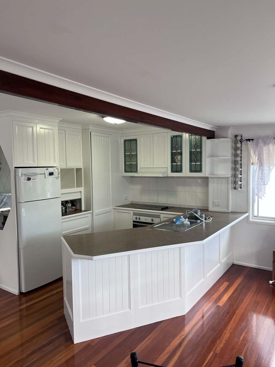 Freshly painted open-plan kitchen interior in a Brisbane home